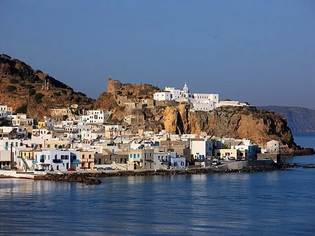 A scenic village with a monastery built on a rocky hill