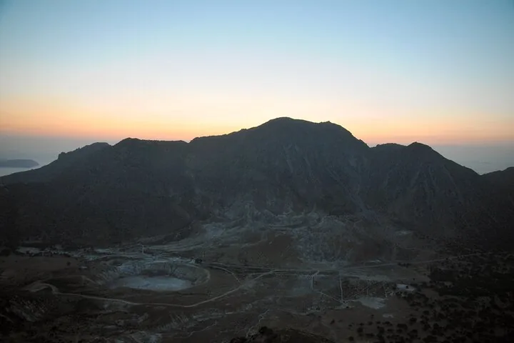 Sunrise or sunset view over the Nisyros volcanic crater